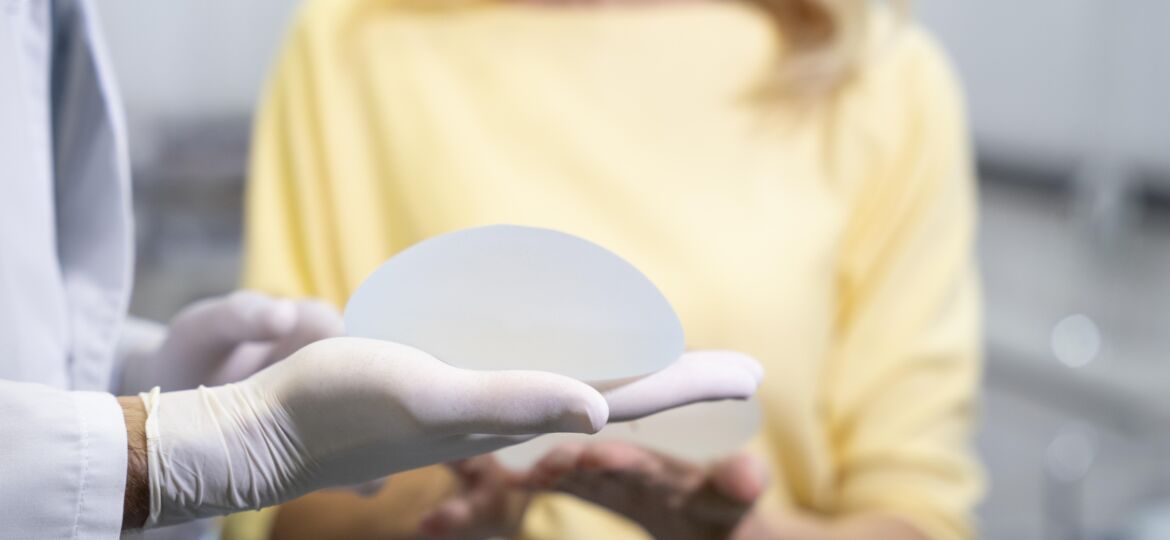 Plastic Surgeon Showing a Breast Implant