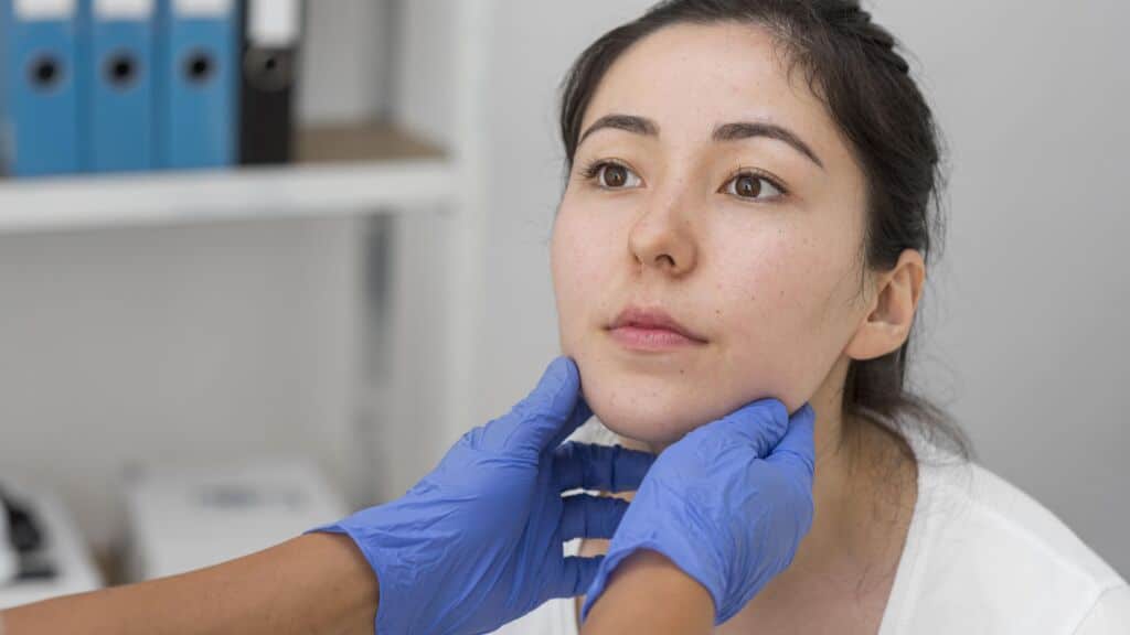 An Asian woman is about to have a nose job procedure