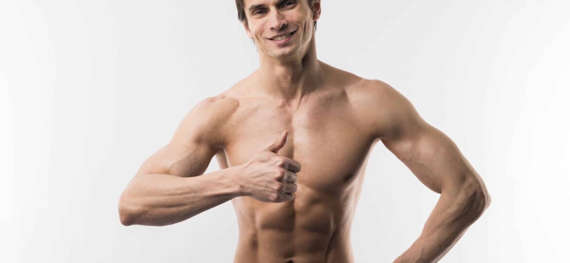 front-view-muscled-man-posing-while-giving-thumbs-up