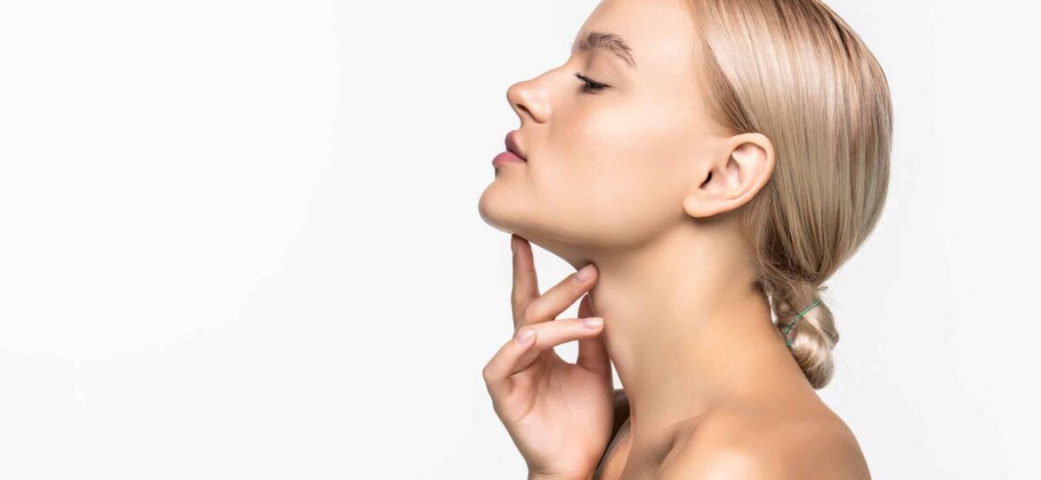 Beautiful young girl touching her face. Youth and skin care concept. Skin care