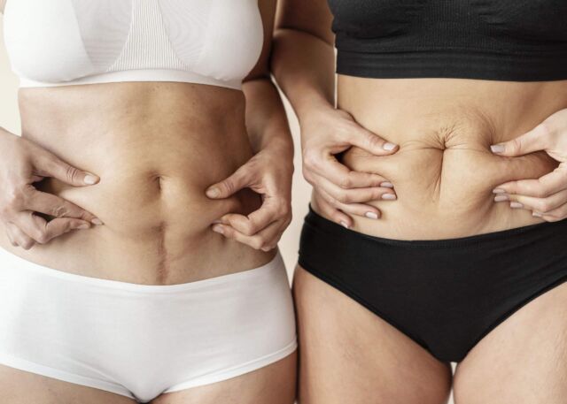 close-up-women-holding-belly